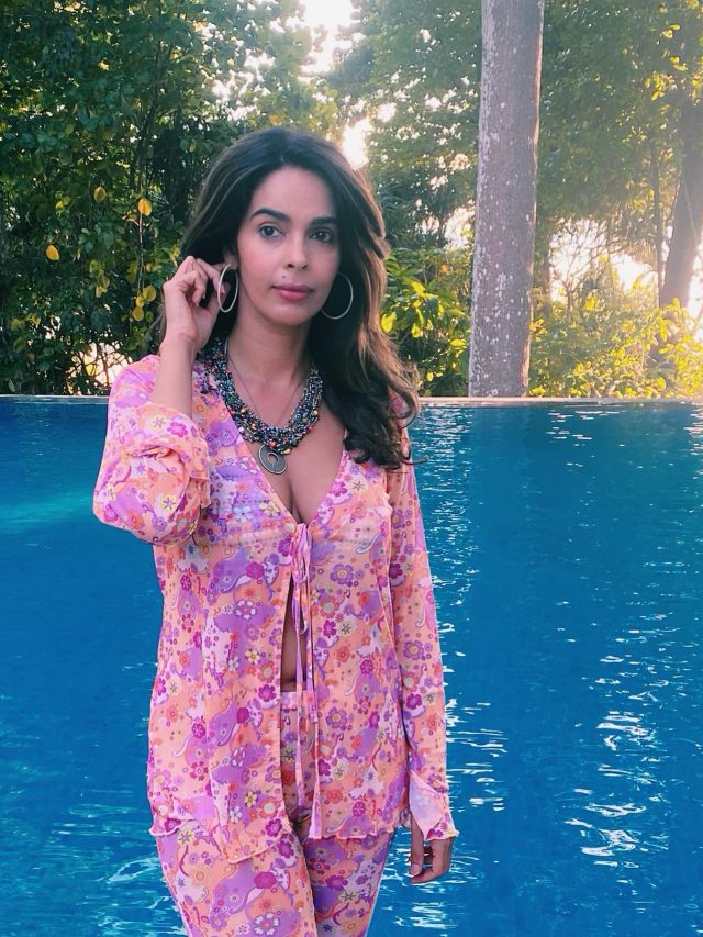 Mallika Sherawat Deep neck outfit is really hot.